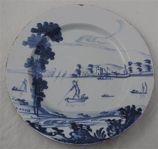 Two English delft ware chargers, 33.5cm and 34.5cm, latter with small area of restoration